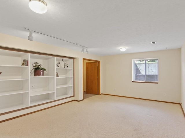 1946 S Century Ln, Spokane Valley, WA 99037 - unfurnished room featuring track lighting and light carpet