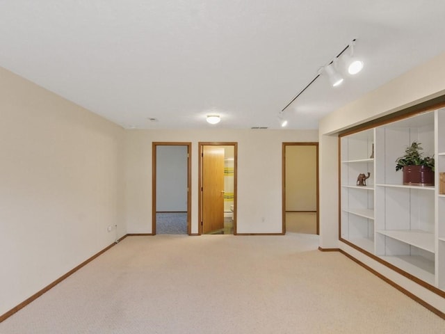 1946 S Century Ln, Spokane Valley, WA 99037 - spare room featuring rail lighting and carpet floors