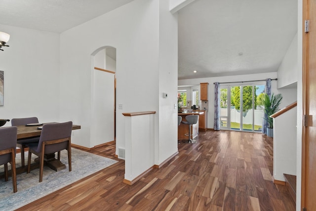 13013 E 37th Ct, Spokane Valley, WA 99206 - dining area featuring arched walkways, dark wood finished floors, and baseboards