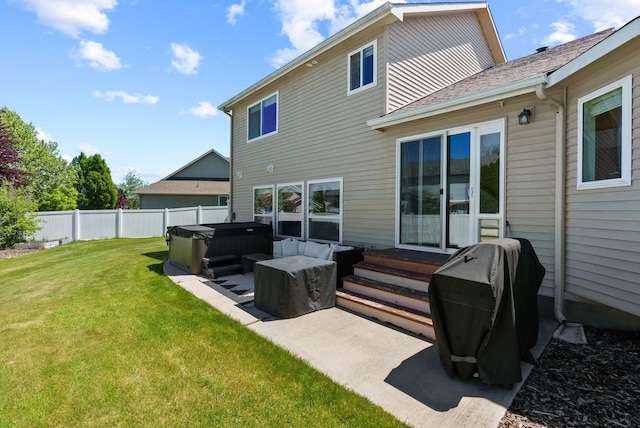 13013 E 37th Ct, Spokane Valley, WA 99206 - back of property with a hot tub, a patio, and entry steps