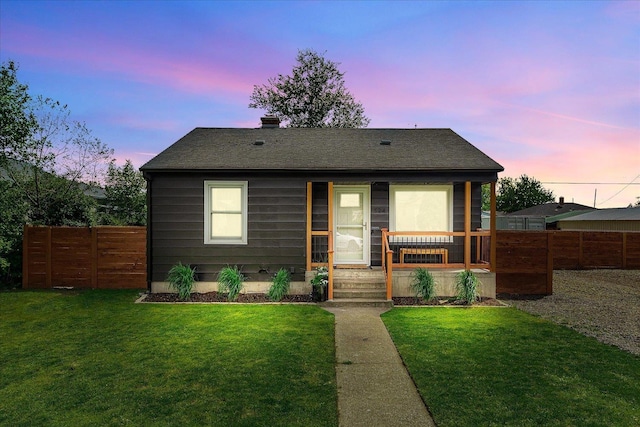 524 E Garland Ave, Spokane, WA 99207 - back of property at dusk with roof with shingles