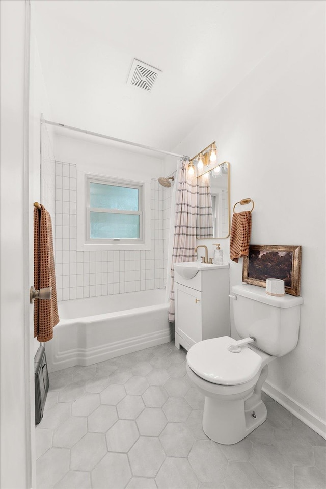 524 E Garland Ave, Spokane, WA 99207 - bathroom with vanity, shower / bath combination with curtain, toilet, and tile patterned floors
