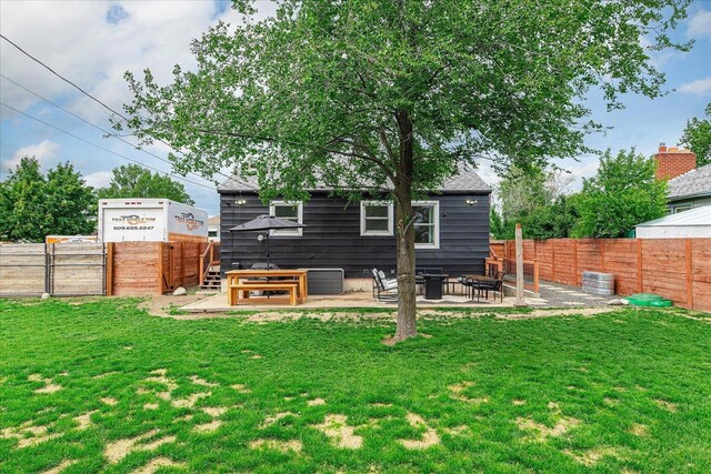 524 E Garland Ave, Spokane, WA 99207 - rear view of property with a patio area, cooling unit, and a fire pit