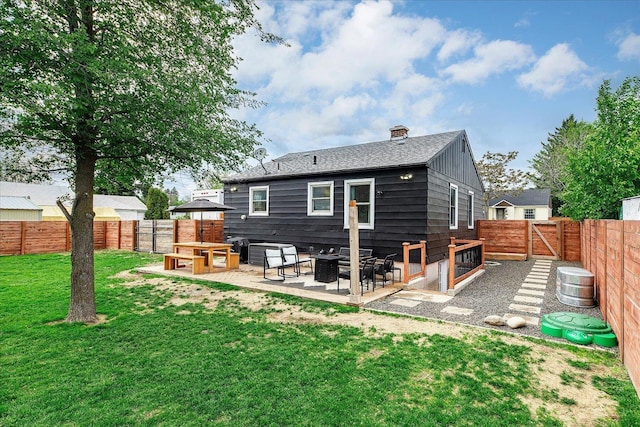 524 E Garland Ave, Spokane, WA 99207 - back of property featuring a patio area and a chimney