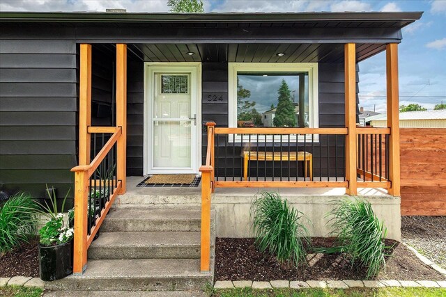 524 E Garland Ave, Spokane, WA 99207 - view of exterior entry featuring a porch