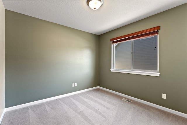 1790 N Winchester St, Liberty Lake, WA 99019 - carpeted spare room featuring baseboards and a textured ceiling