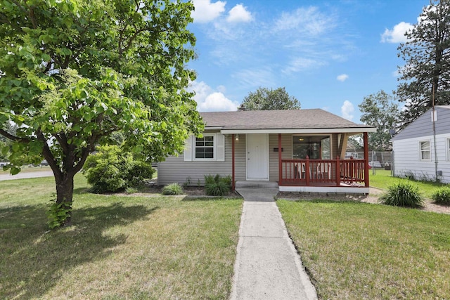 5824 N Washington St, Spokane, WA 99205 - view of front facade featuring covered porch, a front lawn, and a shingled roof