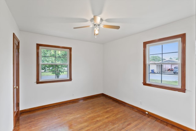 5824 N Washington St, Spokane, WA 99205 - empty room featuring plenty of natural light, light wood finished floors, and baseboards