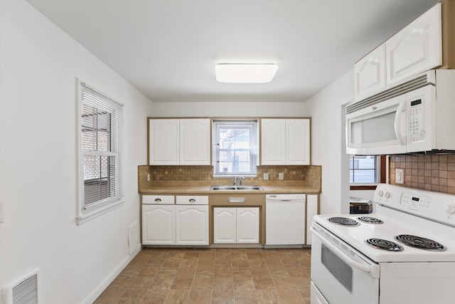 5824 N Washington St, Spokane, WA 99205 - kitchen featuring white appliances, a sink, tasteful backsplash, white cabinets, and light countertops