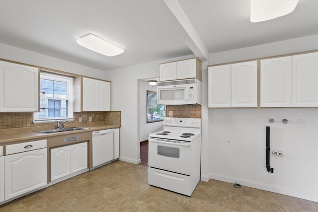 5824 N Washington St, Spokane, WA 99205 - kitchen featuring white appliances, a sink, white cabinets, decorative backsplash, and baseboards