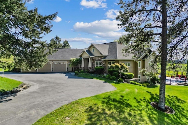 3311 E Chisholm Ln, Spokane, WA 99223 - view of front of house with driveway, a garage, and a front lawn