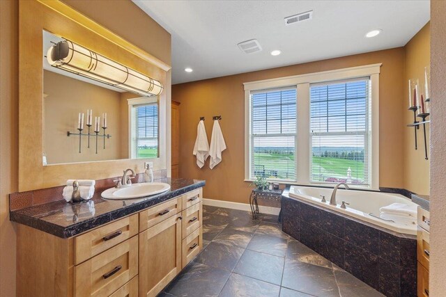 3311 E Chisholm Ln, Spokane, WA 99223 - full bath with vanity, a bath, baseboards, and recessed lighting