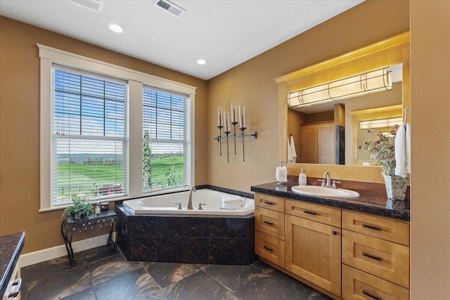 3311 E Chisholm Ln, Spokane, WA 99223 - full bathroom with vanity, a bath, recessed lighting, marble finish floors, and baseboards