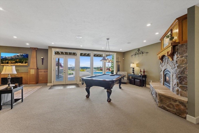 3311 E Chisholm Ln, Spokane, WA 99223 - playroom featuring billiards, light colored carpet, recessed lighting, a fireplace, and a textured ceiling
