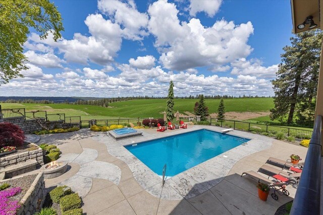 3311 E Chisholm Ln, Spokane, WA 99223 - view of swimming pool with a fire pit, a patio, an in-ground hot tub, and a fenced backyard