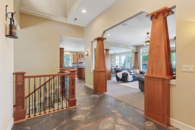 3311 E Chisholm Ln, Spokane, WA 99223 - hall featuring ornate columns, stone tile floors, plenty of natural light, baseboards, and recessed lighting