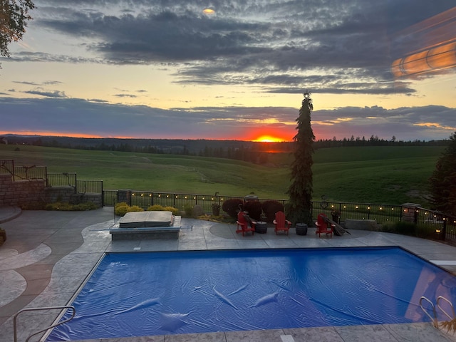 3311 E Chisholm Ln, Spokane, WA 99223 - view of swimming pool with a patio area and a rural view
