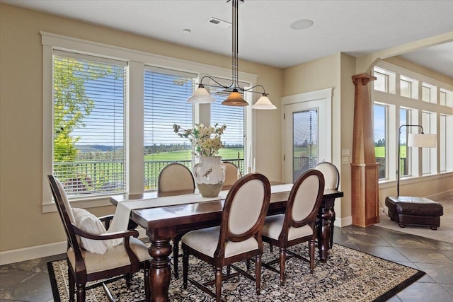 3311 E Chisholm Ln, Spokane, WA 99223 - dining space with healthy amount of natural light, baseboards, and arched walkways