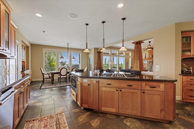 3311 E Chisholm Ln, Spokane, WA 99223 - kitchen featuring appliances with stainless steel finishes, a kitchen island, glass insert cabinets, recessed lighting, and baseboards