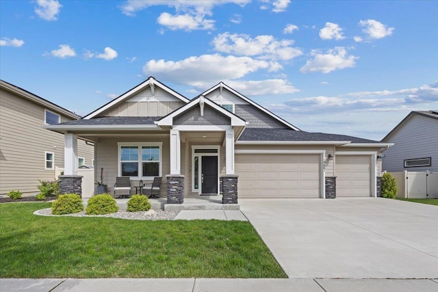 19661 E Riverwalk Ave, Liberty Lake, WA 99016 - craftsman inspired home featuring a porch, an attached garage, concrete driveway, and stone siding
