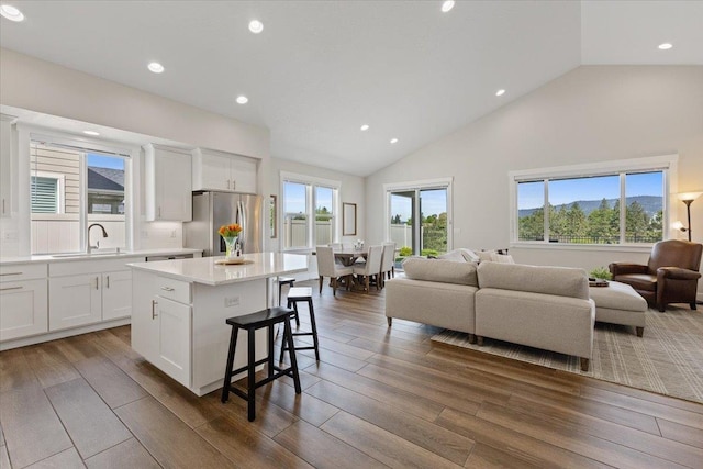 19661 E Riverwalk Ave, Liberty Lake, WA 99016 - kitchen featuring freestanding refrigerator, a sink, open floor plan, light countertops, and a center island