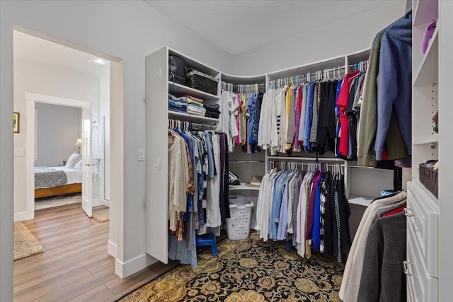 19661 E Riverwalk Ave, Liberty Lake, WA 99016 - spacious closet featuring wood finished floors