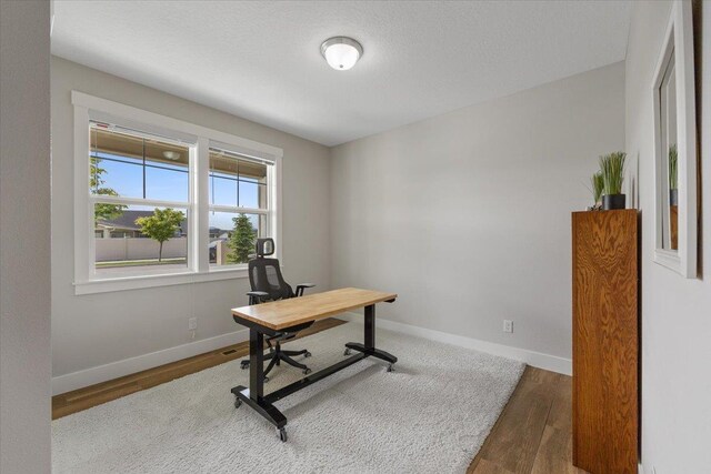 19661 E Riverwalk Ave, Liberty Lake, WA 99016 - home office with wood finished floors and baseboards
