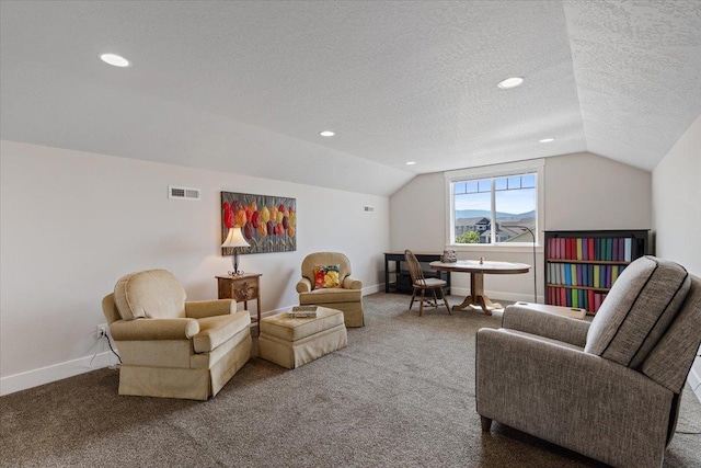 19661 E Riverwalk Ave, Liberty Lake, WA 99016 - carpeted living room featuring lofted ceiling, a textured ceiling, baseboards, and recessed lighting