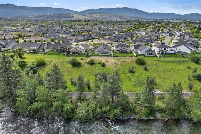 19661 E Riverwalk Ave, Liberty Lake, WA 99016 - aerial view of property and surrounding area featuring nearby suburban area and mountains