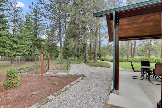 252 N Eagle Dr, Chewelah, WA 99109 - view of patio with a vegetable garden and outdoor dining area