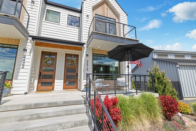 2418 N Atlas Rd, Coeur D Alene, ID 83814 - view of exterior entry with a balcony