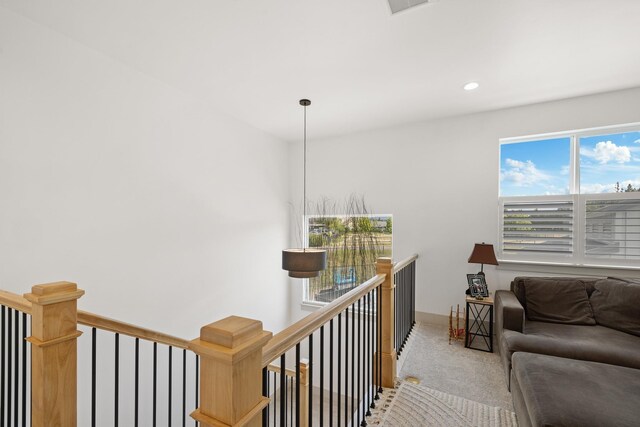 2418 N Atlas Rd, Coeur D Alene, ID 83814 - living area featuring an upstairs landing, carpet floors, recessed lighting, and baseboards