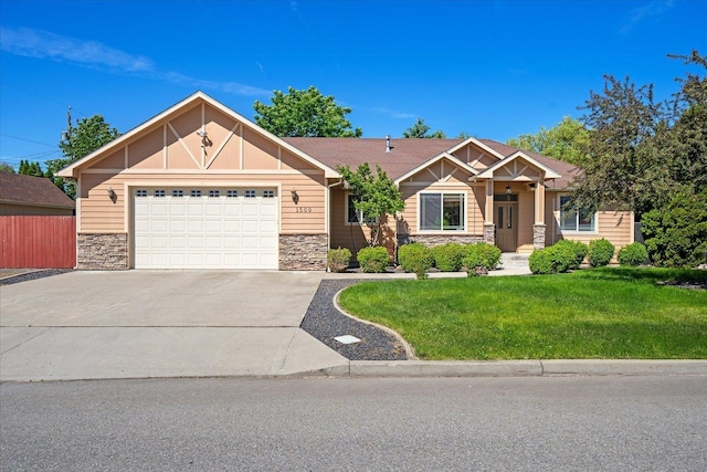 1509 N Arties Ave, Spokane Valley, WA 99016 - craftsman inspired home with stone siding, concrete driveway, a front yard, and an attached garage