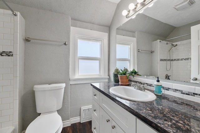 2512 E Rowan Ave, Spokane, WA 99217 - full bathroom featuring vanity, toilet, wood finished floors, tiled shower, and a textured ceiling