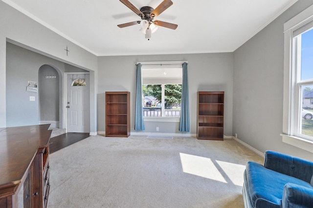 2512 E Rowan Ave, Spokane, WA 99217 - living area with carpet floors, plenty of natural light, ceiling fan, baseboards, and crown molding