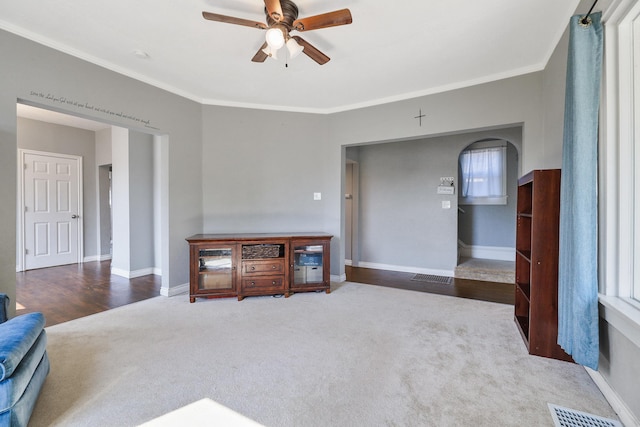2512 E Rowan Ave, Spokane, WA 99217 - living room with a ceiling fan, carpet, ornamental molding, baseboards, and arched walkways