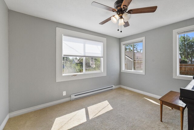 2512 E Rowan Ave, Spokane, WA 99217 - unfurnished room with baseboard heating, carpet flooring, baseboards, and ceiling fan