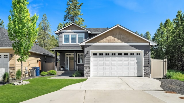 4011 S University Ct, Spokane Valley, WA 99206 - craftsman inspired home with stone siding, a front lawn, a garage, and concrete driveway