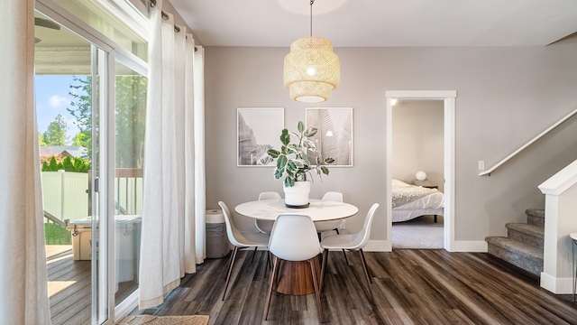 4011 S University Ct, Spokane Valley, WA 99206 - dining space with dark wood-style flooring, stairs, and baseboards