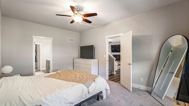 4011 S University Ct, Spokane Valley, WA 99206 - bedroom with light carpet, ensuite bathroom, ceiling fan, and baseboards