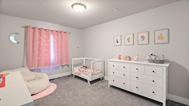 4011 S University Ct, Spokane Valley, WA 99206 - bedroom with carpet floors, a crib, and baseboards
