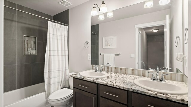 4011 S University Ct, Spokane Valley, WA 99206 - full bathroom featuring double vanity, toilet, and shower / bathtub combination with curtain