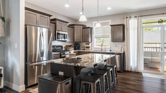 4011 S University Ct, Spokane Valley, WA 99206 - kitchen with appliances with stainless steel finishes, a sink, plenty of natural light, decorative backsplash, and recessed lighting