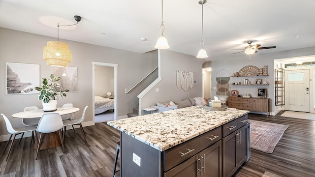 4011 S University Ct, Spokane Valley, WA 99206 - kitchen with dark wood finished floors, open floor plan, a ceiling fan, and a kitchen island