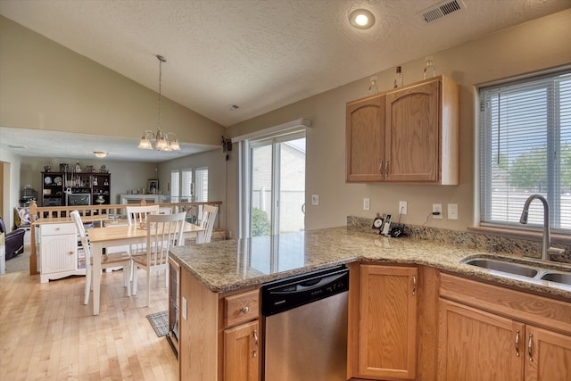 822 N Kelsea St, Medical Lake, WA 99022 - kitchen featuring dishwasher, a sink, healthy amount of natural light, light stone counters, and a textured ceiling