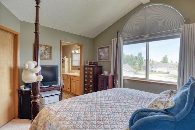 822 N Kelsea St, Medical Lake, WA 99022 - bedroom featuring light colored carpet, lofted ceiling, and ensuite bathroom