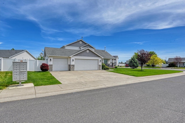 822 N Kelsea St, Medical Lake, WA 99022 - view of front of home with an attached garage, driveway, and stone siding