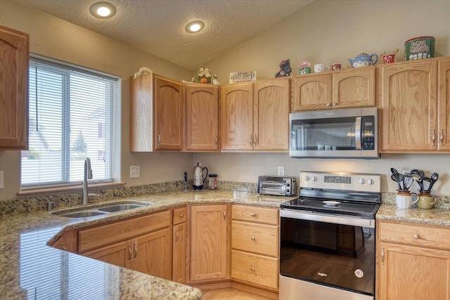 822 N Kelsea St, Medical Lake, WA 99022 - kitchen featuring stainless steel appliances, a sink, vaulted ceiling, a textured ceiling, and recessed lighting