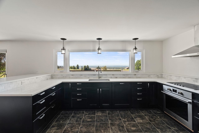 4626 E Orchard Rd, Spokane, WA 99217 - kitchen featuring a sink, oven, dark cabinets, and black electric stovetop