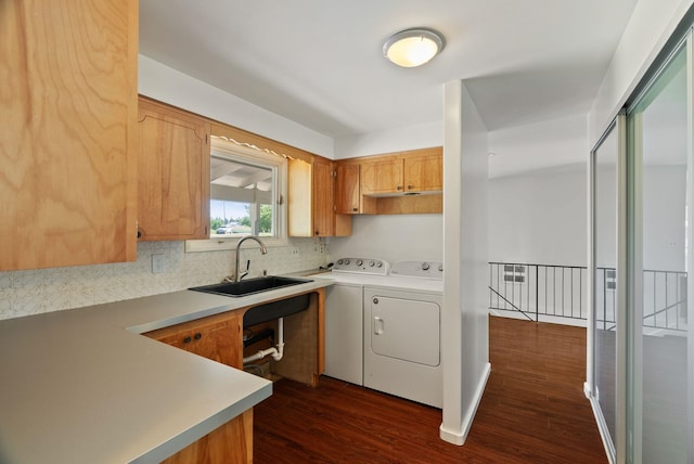 4626 E Orchard Rd, Spokane, WA 99217 - kitchen featuring washer and dryer, a sink, tasteful backsplash, dark wood finished floors, and light countertops